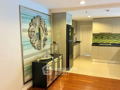 Modern kitchen with stylish decor and open layout, featuring sleek cabinetry and vibrant backsplash.