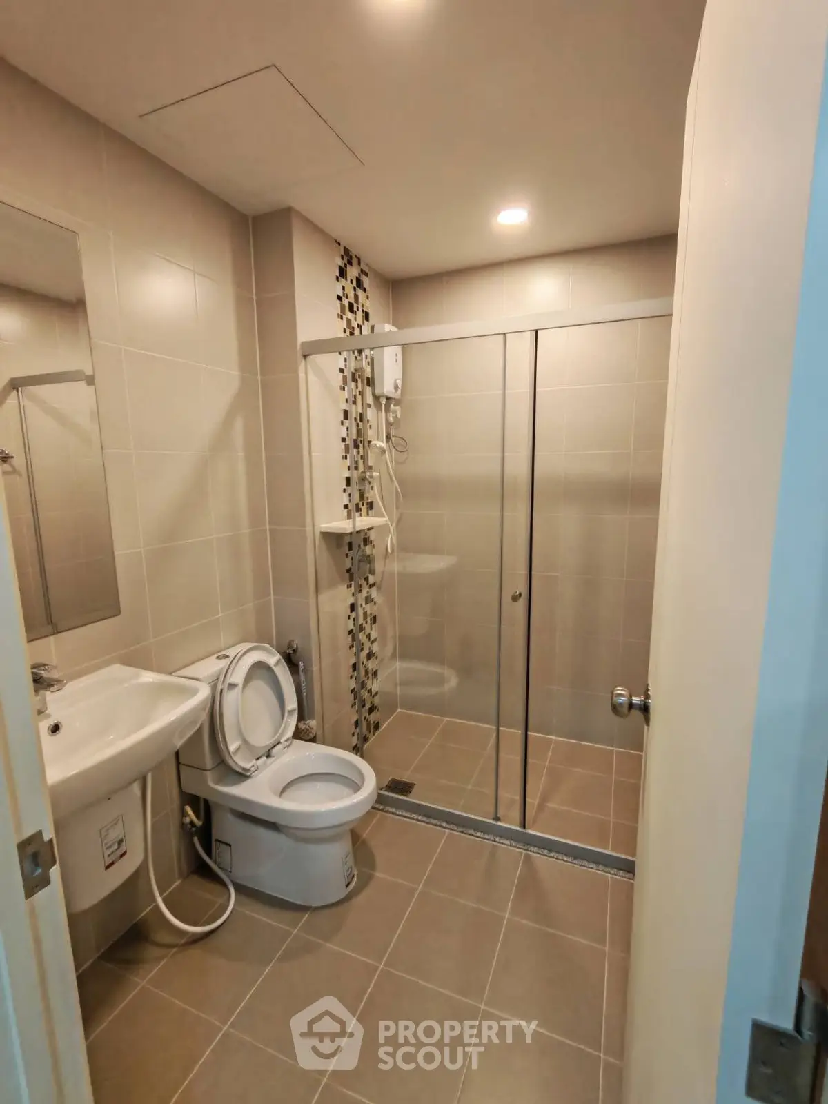 Modern bathroom with glass shower and sleek fixtures