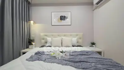 Cozy modern bedroom with stylish decor and soft lighting