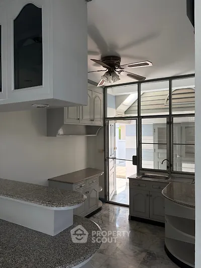 Modern kitchen with open layout and granite countertops