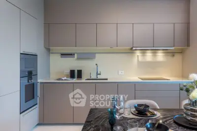 Modern kitchen with sleek cabinetry and elegant dining setup