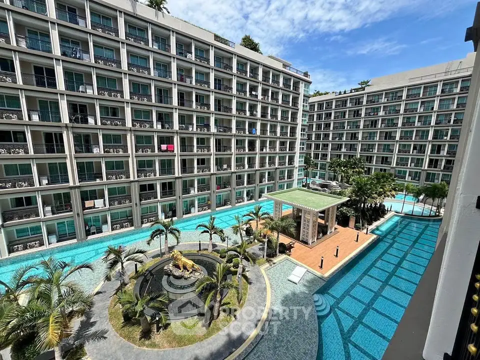 Luxurious apartment complex with stunning pool and lush landscaping