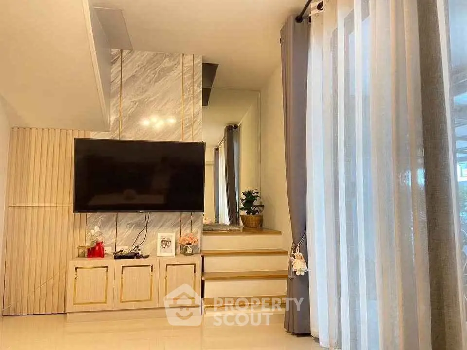 Elegant living room with modern TV setup and stylish decor