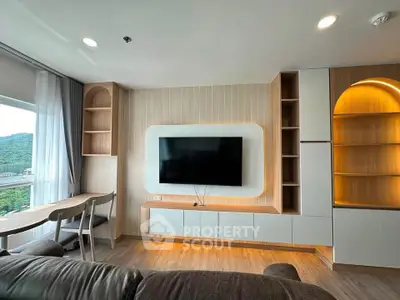 Modern living room with built-in TV unit and scenic window view