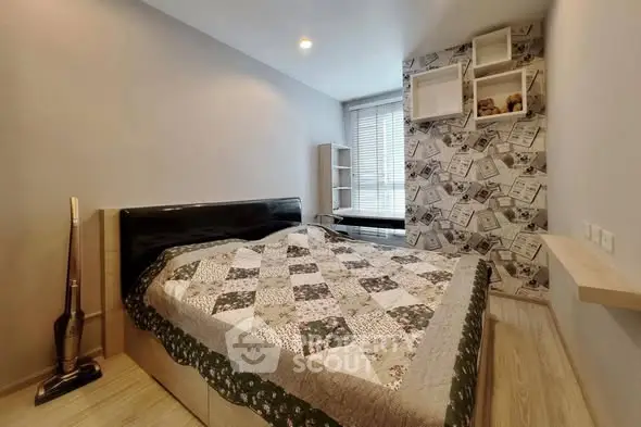 Cozy bedroom with stylish decor and ample natural light