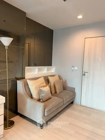 Modern living room with stylish sofa and elegant decor in a contemporary apartment.