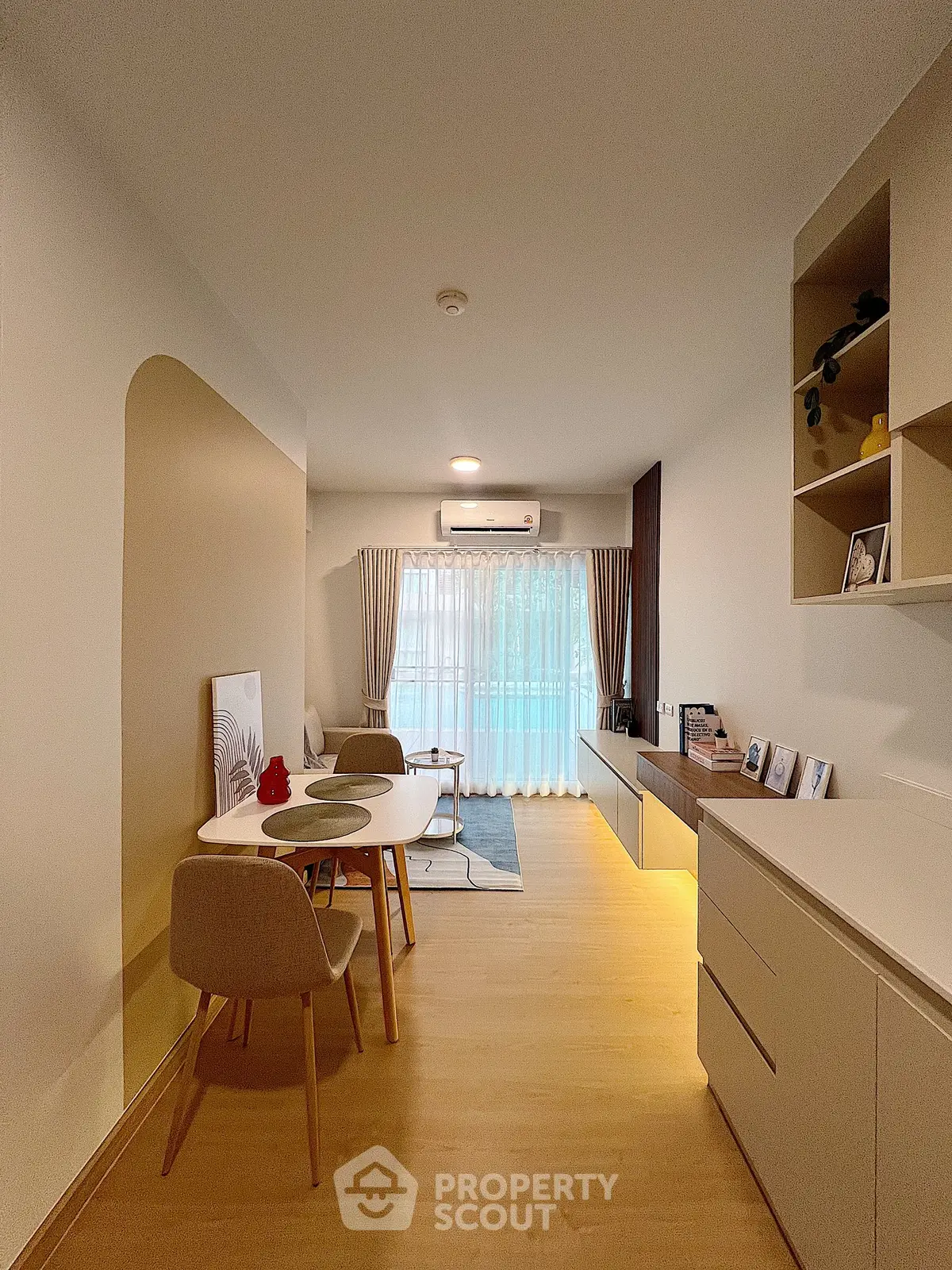 Modern living room with stylish furniture and large window for natural light.