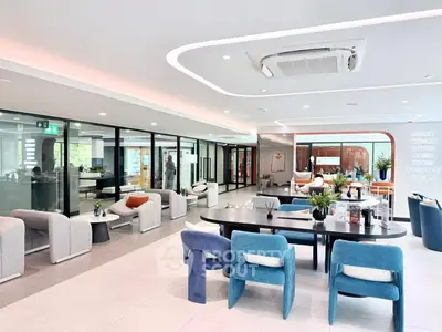 Modern office space with stylish furniture and glass partitions