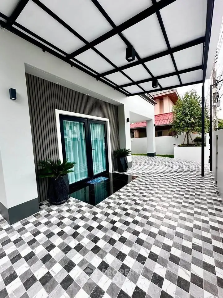 Modern home entrance with stylish checkered flooring and sleek design