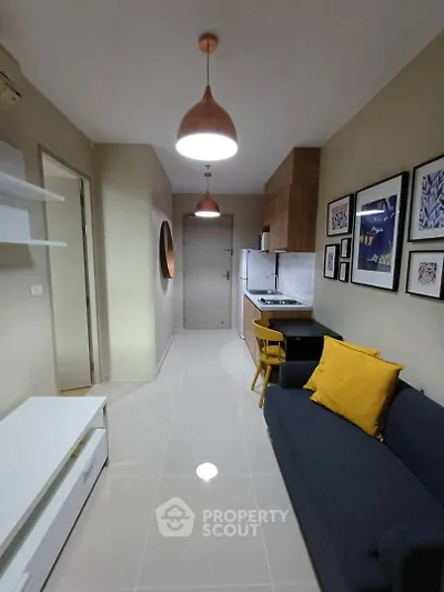 Modern apartment interior with stylish living room and compact kitchen