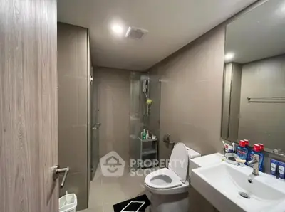 Modern bathroom with sleek design and glass shower enclosure