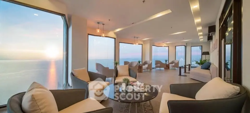 Luxurious living room with panoramic ocean views and modern furnishings, perfect for relaxation and entertaining.