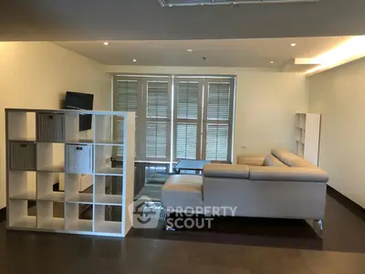 Spacious modern living room with sleek furniture and natural light