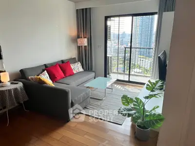 Modern living room with balcony view, stylish decor, and natural light in urban apartment.