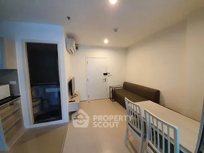 Modern living room with minimalist furniture and open layout in a cozy apartment.