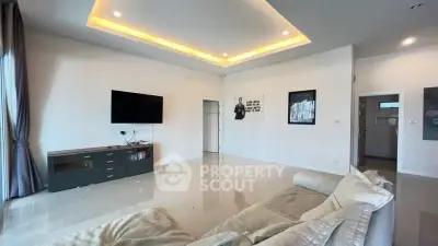 Spacious modern living room with sleek design and ambient lighting