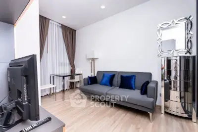 Modern living room with sleek gray sofa and stylish decor