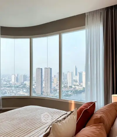 Luxurious bedroom with panoramic city view and elegant decor