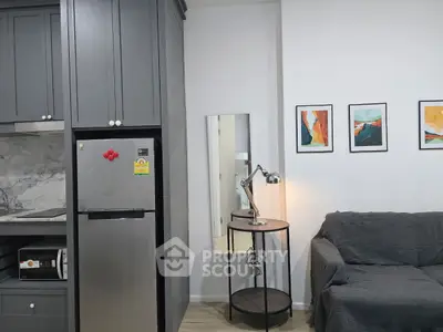 Modern compact living room with sleek kitchen and stylish decor