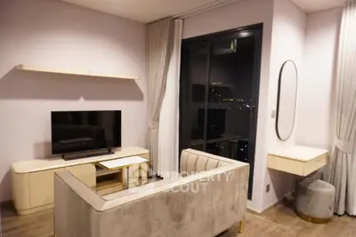 Modern living room with sleek furniture and city view window, perfect for urban lifestyle.