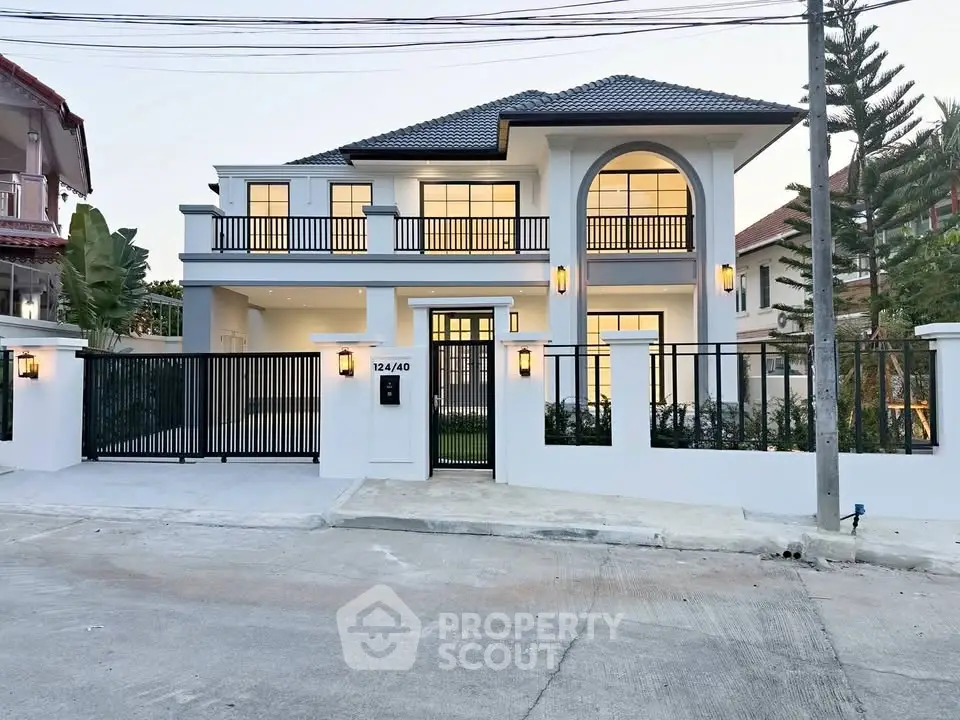 Stunning modern two-story house with elegant facade and spacious driveway in a serene neighborhood.