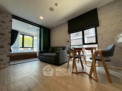 Modern living room with stylish decor and natural light in urban apartment