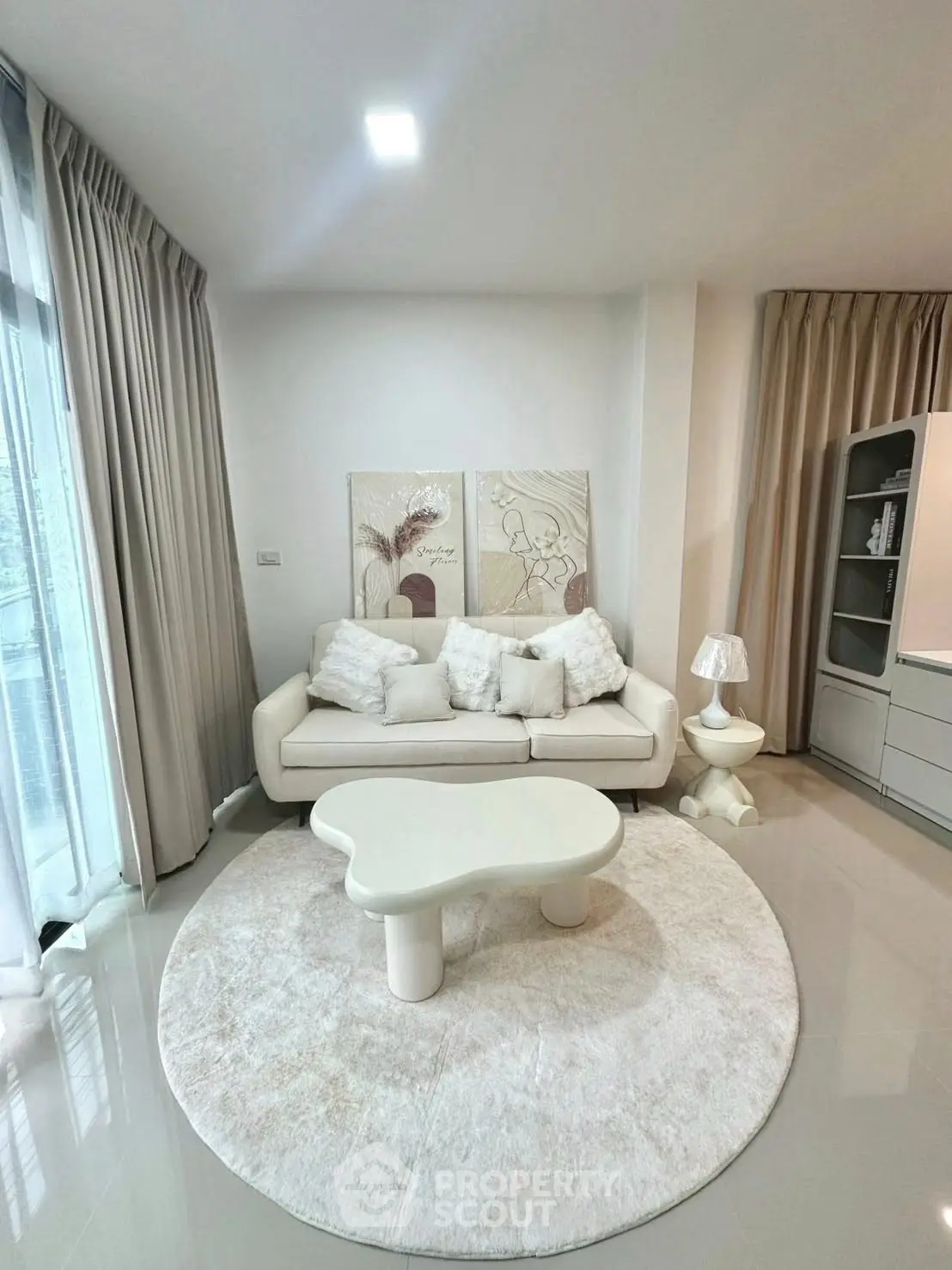 Modern living room with stylish furniture and elegant decor in a bright, airy space.