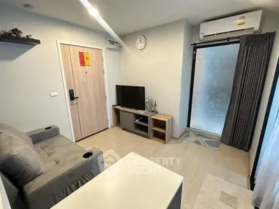 Cozy living room with modern decor and air conditioning in a stylish apartment.