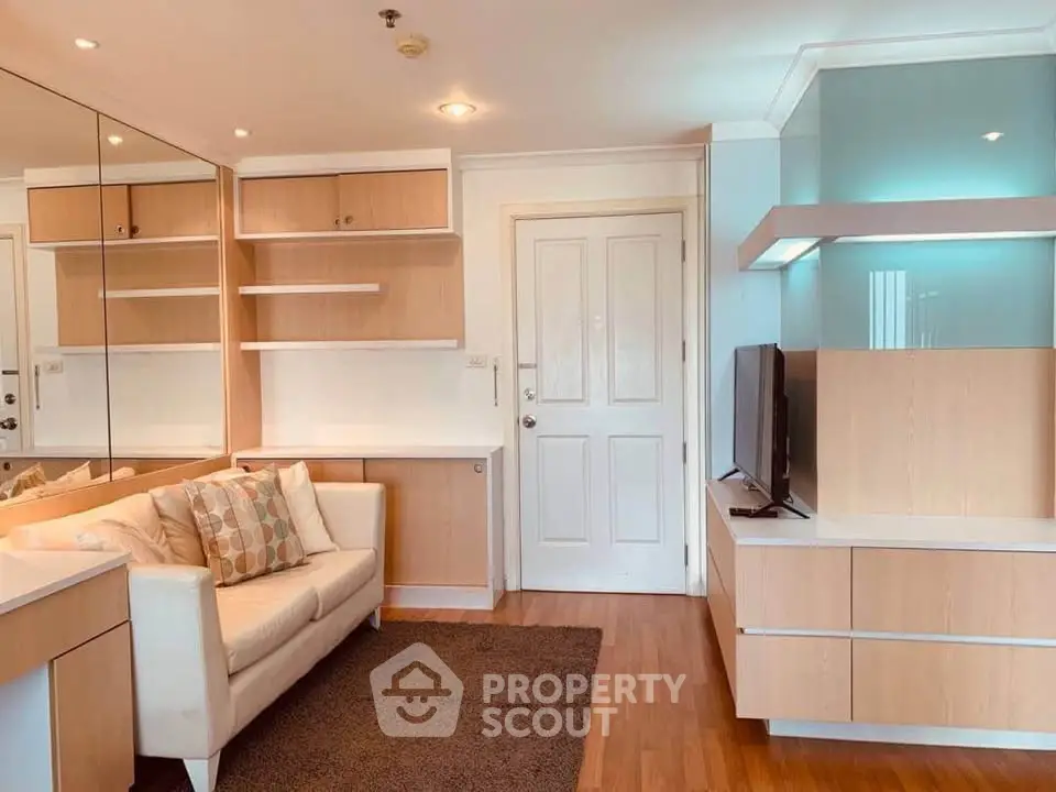 Charming living room with modern wooden shelves and cozy sofa in a bright apartment.