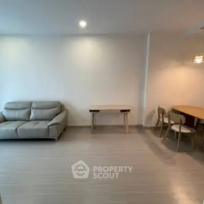 Modern living room with sleek furniture and minimalist design, perfect for contemporary urban living.
