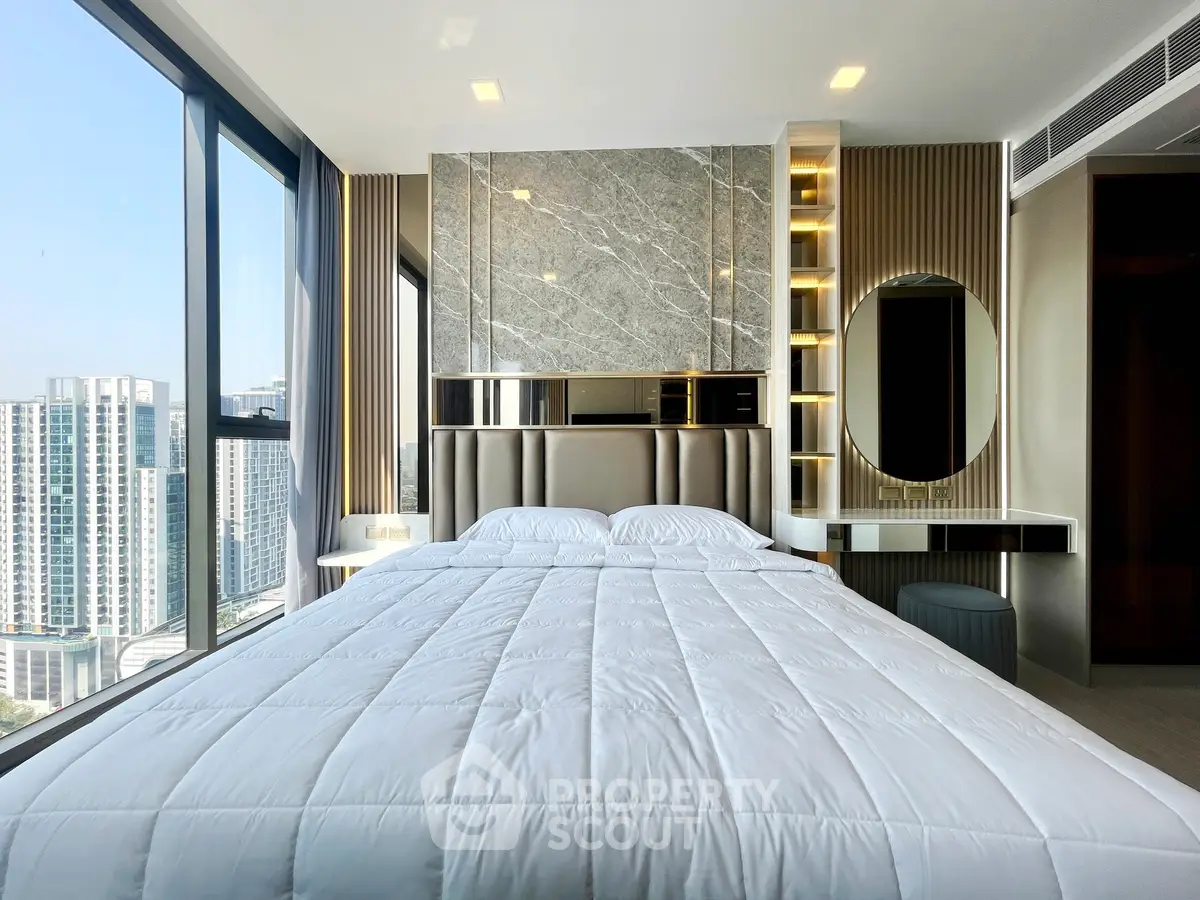 Luxurious modern bedroom with panoramic city views and elegant decor