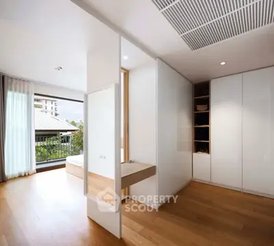 Spacious modern bedroom with balcony and ample storage