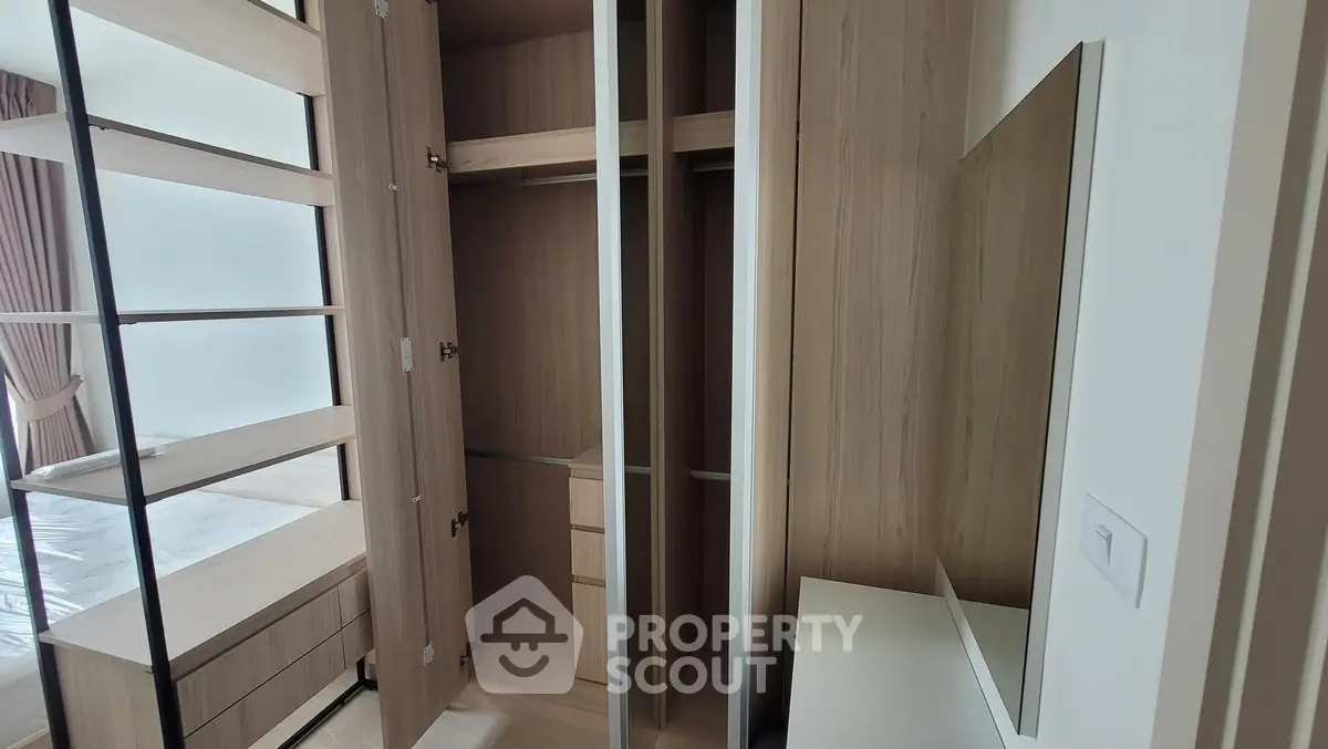 Spacious modern walk-in closet with wooden finish and ample storage space.
