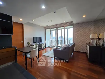 Spacious living room with modern decor and balcony view in a luxury apartment.