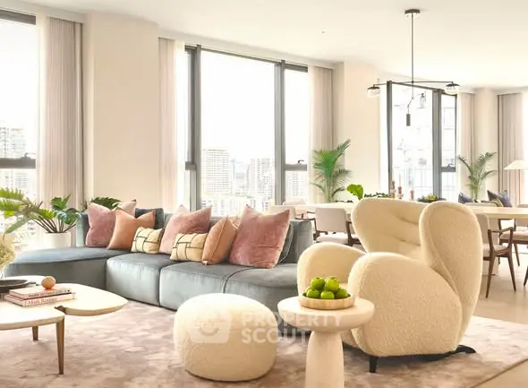 Luxurious modern living room with plush seating and city view, perfect for relaxation and entertaining.