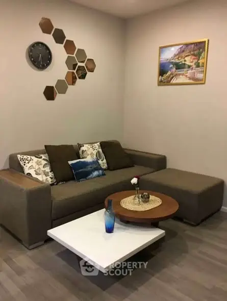 Stylish living room with modern decor and cozy seating area.