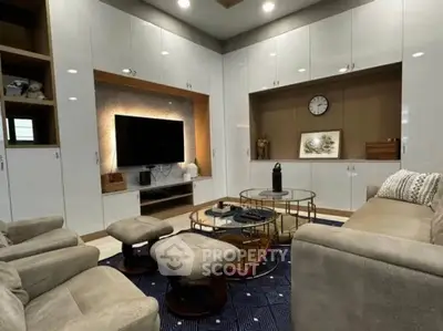 Luxurious living room with modern decor and built-in entertainment center