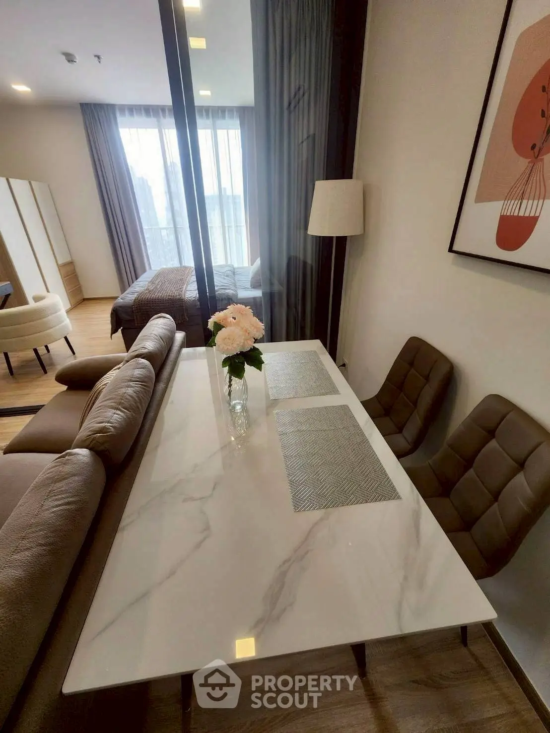 Modern open-plan living and dining area with stylish decor and natural light.
