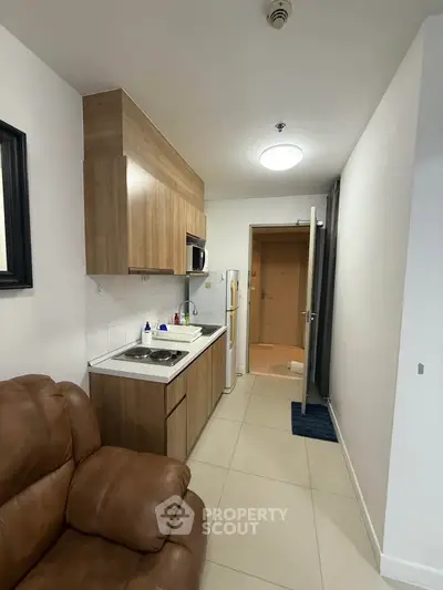 Cozy apartment kitchen with modern appliances and sleek cabinetry