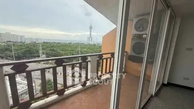 Spacious balcony with stunning city view and modern glass doors