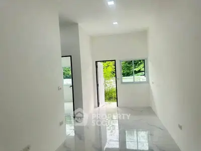 Bright minimalist room with marble flooring and garden view, perfect for modern living.