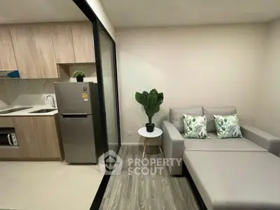 Modern compact living room with kitchenette and stylish decor