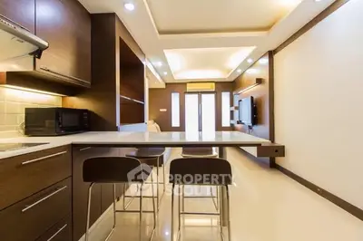 Modern kitchen with sleek wooden cabinets and open layout design