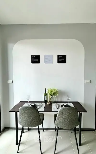 Modern dining area with stylish table and chairs, perfect for cozy meals.