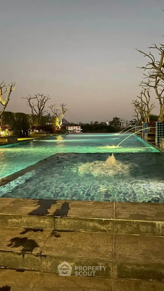 Luxurious outdoor pool with serene evening ambiance and elegant lighting, perfect for relaxation and leisure.