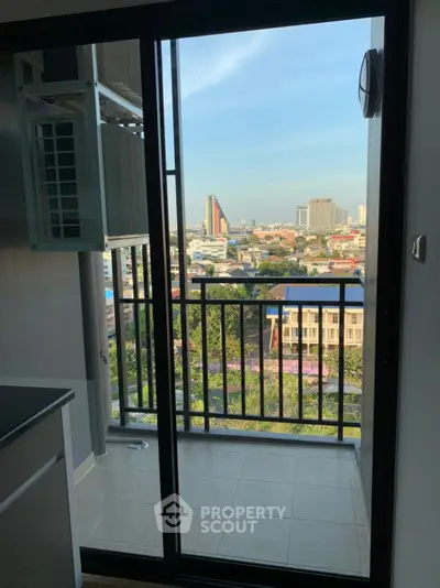Charming balcony with city view, perfect for relaxation and enjoying the skyline.