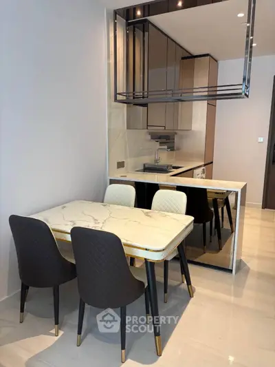Modern kitchen with elegant dining area and sleek cabinetry