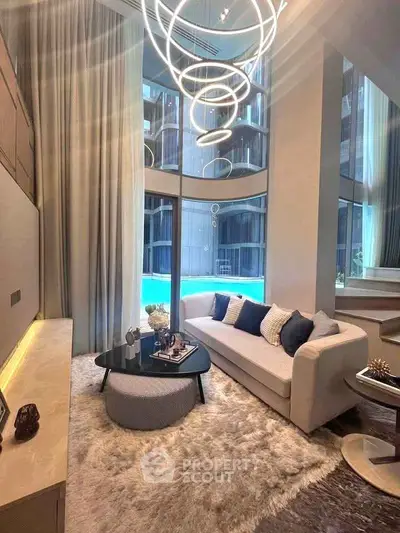 Luxurious modern living room with high ceilings and elegant lighting in a stylish apartment.