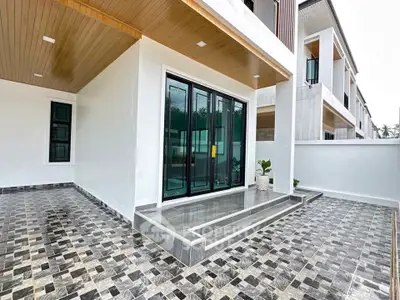 Modern exterior with sleek design and spacious tiled patio