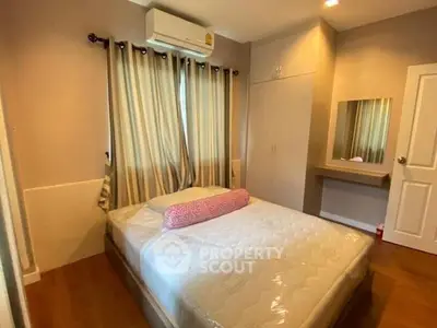 Cozy bedroom with air conditioning and built-in wardrobe, perfect for restful nights.